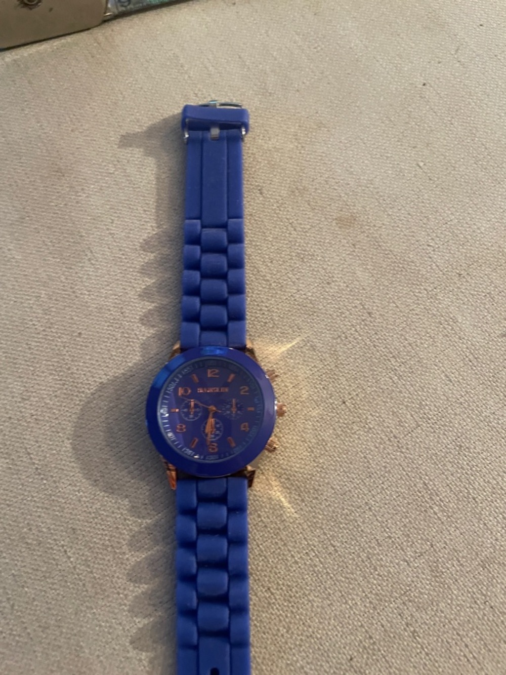 Blue Silicone Band Watch with Rose Gold Accents needs battery